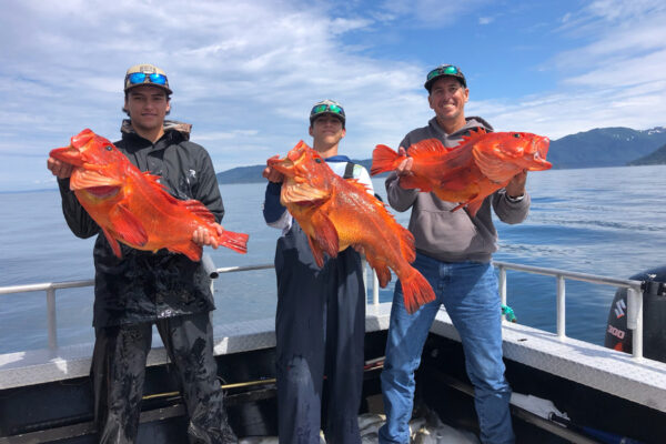 Group of people with caught fish