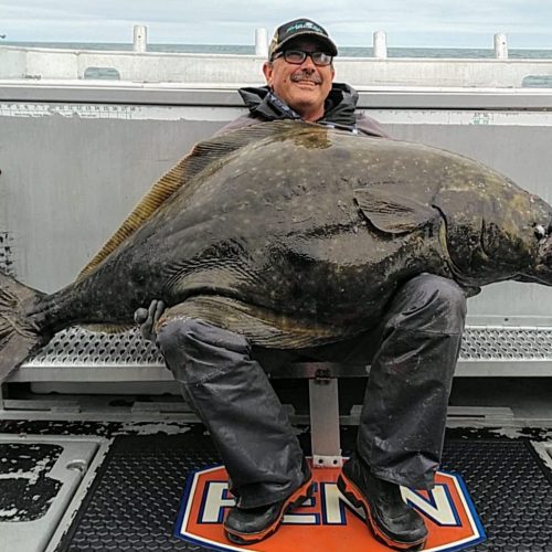 a man with a giant fish in his leap