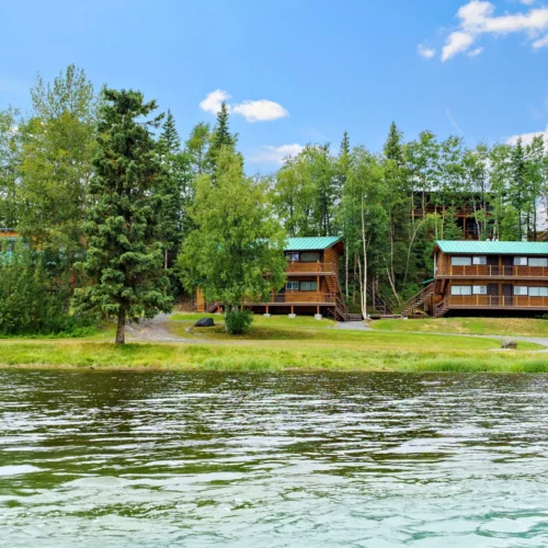 wooden lodges by the river
